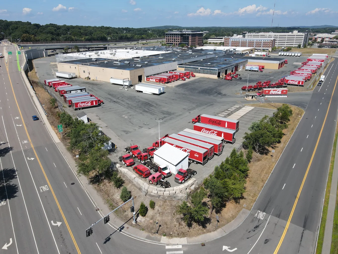 Coca-Cola trucks parked at distribution center