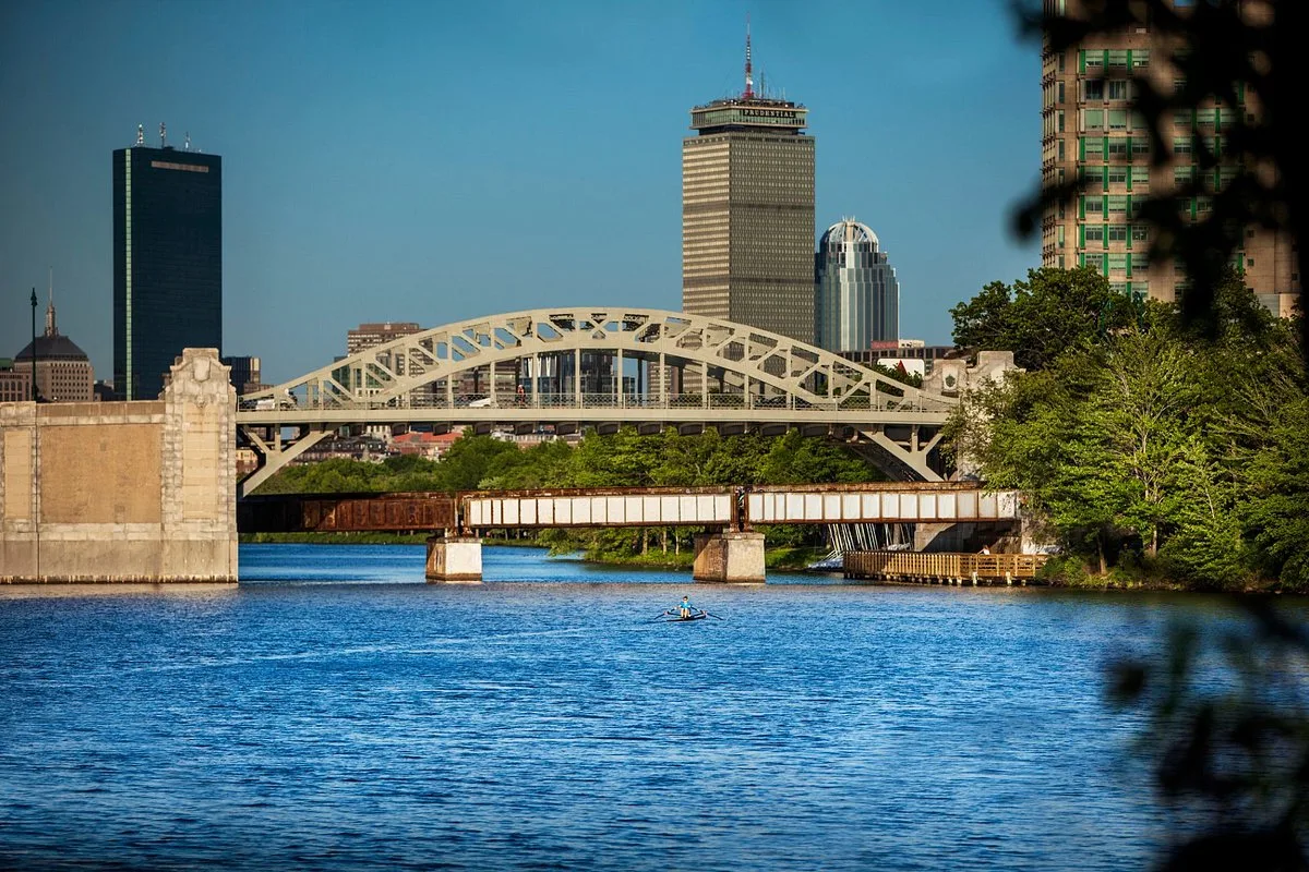 Arched bridge over Charles River, Boston skyline